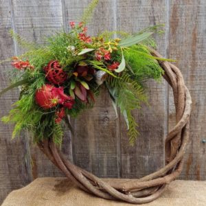 WREATH ~Designer : Premium Greens Australia ~ Foliage & Flowers : Umbrella Fern™, Sea Star Fern™, Christmas Bush, Bribie Pine, Emu Feather™. Koala Fern™, leucadendron, kangaroo paw, eucalyptus